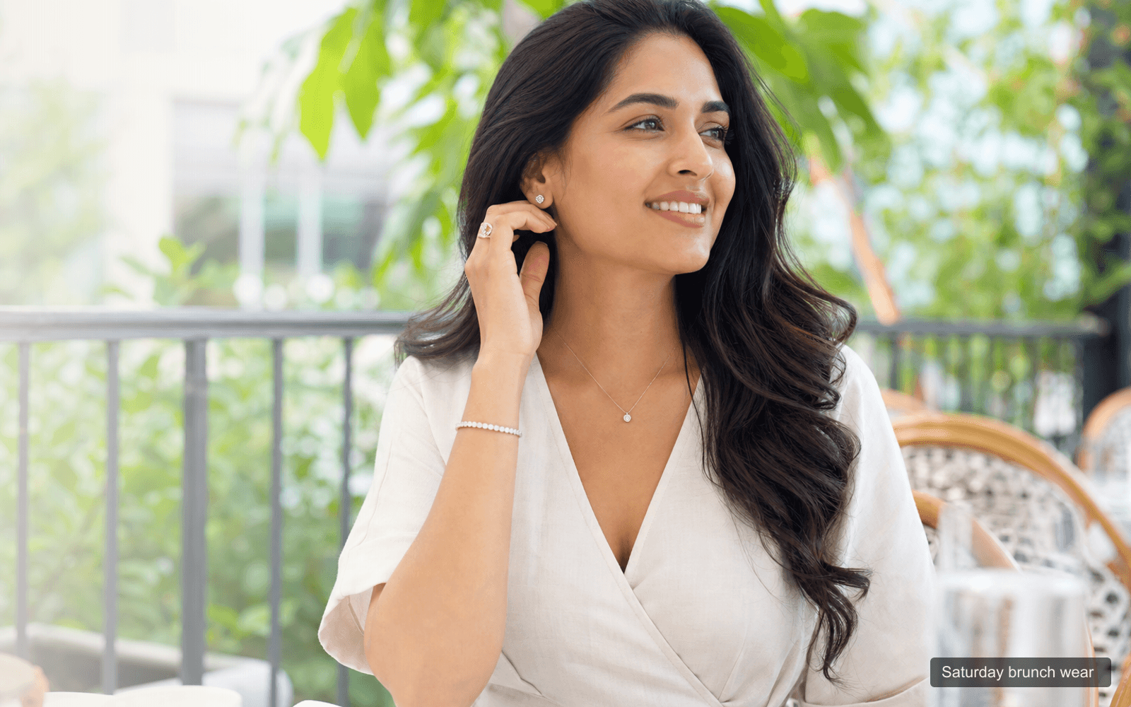 Woman wearing minimal diamond jewellery